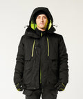 A person stands facing forward wearing the Portwest EV4 Winter Parka Jacket (EV461) with neon yellow-green lining and details, paired with black gloves and a black beanie. The background is plain white.