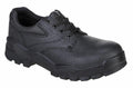 The PW303 by Portwest is a black work shoe featuring a textured surface, lace-up design, and thick treaded sole.