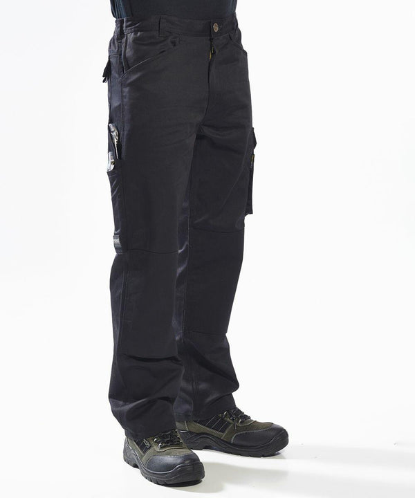 A person wearing Portwest PW342 work pants and black shoes stands against a plain white background.