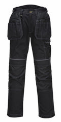 The PW369 by Portwest are black work pants featuring multiple pockets and reinforced knee areas.