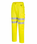 Bright yellow high-visibility safety pants with reflective stripes around the legs and multiple pockets, Portwest PW413.