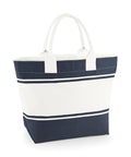 The Bags canvas tote features two white handles, a central white section bordered by navy blue panels, and horizontal navy stripes near the top and bottom.
