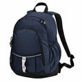A Quadra QD057 backpack in dark blue, featuring multiple zippered compartments and a black strap, is positioned upright against a white background.