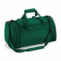 A Quadra QD070, which is a green duffel bag featuring a top zipper, two handles, and an adjustable shoulder strap.