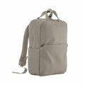 The QD271 gray backpack by Quadra features a top handle and two shoulder straps. Its design includes a zippered main compartment and a spacious front pocket, embodying a simple and minimalist aesthetic.