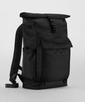 A black Quadra QD275 roll-top backpack with a front flap pocket, zippered compartment, side mesh pocket, and padded shoulder straps.