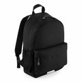 The Quadra QD445 is a plain black backpack featuring a front pocket and two adjustable straps, displayed on a white background.