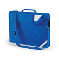 The Quadra QD457 is a blue satchel featuring a shoulder strap, front pocket, and a Velcro flap with a slot for displaying a name tag. It includes a handle on top and has a reflective strip at the bottom corner for added visibility.