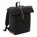 A black canvas backpack with brown leather accents, featuring a flap closure and adjustable shoulder straps, from the Quadra QD655 collection.
