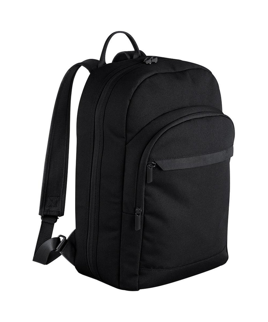 The Bags rucksack features two main zipped compartments, a small front zipped pocket, and adjustable shoulder straps, all in plain black and displayed against a white background.