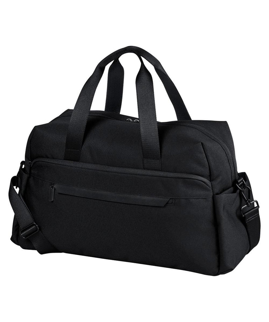 The "Bags" duffel is plain black with two short handles, a detachable shoulder strap, and a zipped front pocket. The product is shown against a white background.
