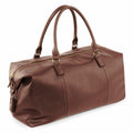 The Quadra QD878 is a brown leather duffle bag featuring two handles and a zippered main compartment.