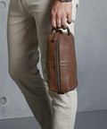 Person holding a Quadra QD879 by its handle.