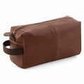 Quadra's QD879 is a brown leather toiletry bag featuring a zipper and a handle on one side.