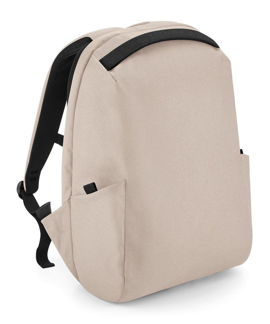 The Bags rucksack is light beige with black adjustable shoulder straps, a black top handle, two side pockets, and a minimalist design. It is shown on a plain white background.