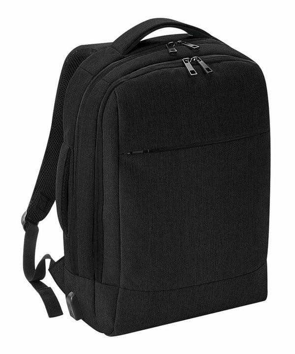Quadra QD990 black backpack with padded shoulder straps and multiple zippered compartments, set against a white background.