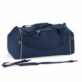 Quadra's QS070 is a spacious, dark blue duffel bag equipped with multiple zippered compartments, durable handles, and an adjustable shoulder strap. It also features contrasting light-colored piping along the edges.
