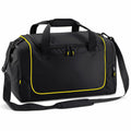The Quadra QS077 is a black duffel bag with yellow piping featuring two short handles and a detachable shoulder strap. It includes a zippered main compartment, a front pocket, and additional mesh pockets on the sides.