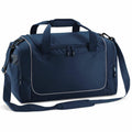 The QS077 by Quadra is a dark blue duffel bag that includes a detachable shoulder strap and two handles. It features zippered main and side compartments, enhanced with subtle light trim accents.