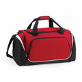 Quadra's QS270 is a red and black duffel bag with black straps and a white accent line, featuring a zippered main compartment and side pockets.