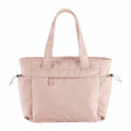 A light pink tote bag from Quadra, featuring two handles, a front zipper pocket, and side pockets. The product name is QS303.