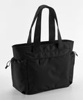 Black Quadra QS303 tote bag with two shoulder straps and multiple pockets, including two side pockets with drawstrings. The bag has a sleek design with a zippered front compartment.
