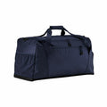 The Quadra QS470 is a spacious navy blue duffel bag, featuring a top handle and zippered compartments, set against a white background. With its sleek, minimalist design, this bag is perfect for travel or sports use.