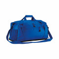 Introducing the Quadra QS477: a stylish blue duffel bag featuring two handles, a shoulder strap, and multiple zipped compartments.