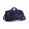 The QS477 by Quadra is a dark blue duffel bag featuring a zippered front pocket, an adjustable shoulder strap, carry handles, and side pockets, set against a white background.