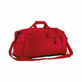 A Quadra QS477 duffel bag in red, equipped with multiple zippered compartments, a detachable shoulder strap, and sturdy handles.