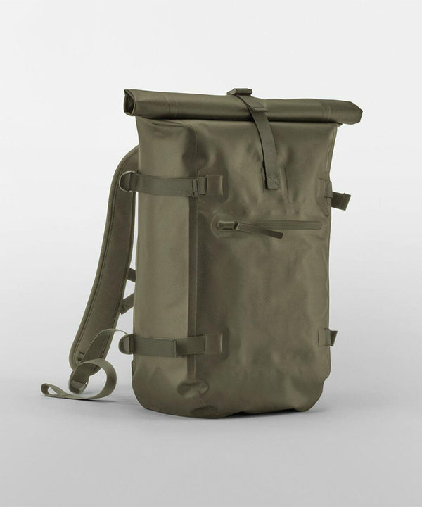 A minimalist olive green roll-top backpack, Quadra QS575, with adjustable shoulder straps and a front zipper pocket, placed against a plain white background.
