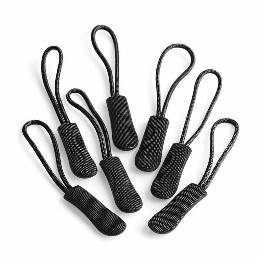 Seven black Quadra QX505 zipper pulls with loop handles arranged on a white background.