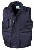 Result Workguard's R127A is a navy blue padded vest featuring multiple pockets, a zipper, and snap buttons.