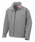 The Result R128X is a gray zip-up jacket with a high collar and long sleeves, featuring multiple zippered pockets, including one on the left chest and two at the waist. The fabric has a smooth and slightly shiny appearance.
