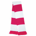The Result Winter Essentials R146X is a knitted scarf adorned with alternating red and white horizontal stripes and finished with red fringe at the ends.