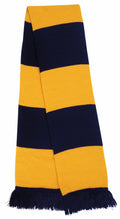 The Result Winter Essentials R146X is a knitted scarf characterized by wide horizontal stripes in yellow and navy blue, complete with fringed edges.