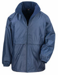 The Result Core R203X is a long-sleeve jacket in blue featuring a front zipper, elastic cuffs, and a high collar. It seems to be made of a shiny, water-resistant material.
