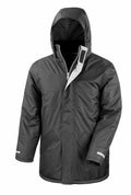 The R207X by Result Core is a black winter jacket with a hood, featuring a zip and velcro closure, two front pockets, and adjustable cuffs.