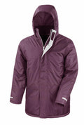 The Result Core R207X features a purple hooded winter jacket with a zipper and Velcro closure, two front pockets, and adjustable cuffs.