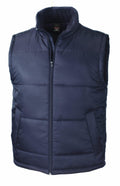 The R208X by Result Core is a sleeveless navy blue puffer vest featuring a high collar and zippered front. It includes two side pockets and a quilted design, delivering a casual and sporty appearance.