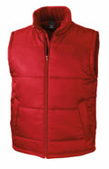 The R208X from Result Core is a red, sleeveless padded vest featuring a high collar, front zipper, and two side pockets, showcased against a plain white background.