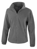 The Result Core R220F is a plain gray fleece jacket featuring a full front zipper, high collar, and two zippered side pockets. It has long sleeves with elastic cuffs and is displayed against a white background.