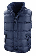 The Result Core R223X is a navy blue puffer vest featuring a high collar and a front zipper.