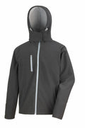 The Result Core R230M is a black hooded jacket featuring a high collar and front zipper. It includes two front zippered pockets, and the hood is equipped with adjustable drawstrings.