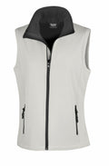 Introducing the Result Core R232F: a sleek sleeveless vest in light gray, equipped with a front zipper. It features two zippered pockets and boasts a high collar lined in darker gray fabric.