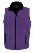 The Result Core R232M is a purple sleeveless vest featuring a black zipper, two zippered front pockets, a high collar, and a simple solid design.