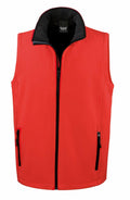 Introducing the Result Core R232M: a stylish sleeveless red vest with a high collar, black zipper, and two front zippered pockets. Its sleek design makes it ideal for outdoor activities.