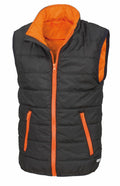 The R234J by Result Core is a black puffer vest with striking orange lining and zippers, complemented by two front pockets equipped with orange zippers.