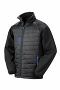 The Result Genuine Recycled R237X jacket in black showcases quilted front and back panels. It features long sleeves, a full zip closure, two zippered side pockets, and a zippered chest pocket, all enhanced with blue accents.