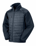 Introducing the R237X, an insulated jacket from Result Genuine Recycled, featuring a black and dark gray design with a zippered front. This stylish piece includes a high collar, elastic cuffs, and convenient zippered pockets on both the chest and sides.